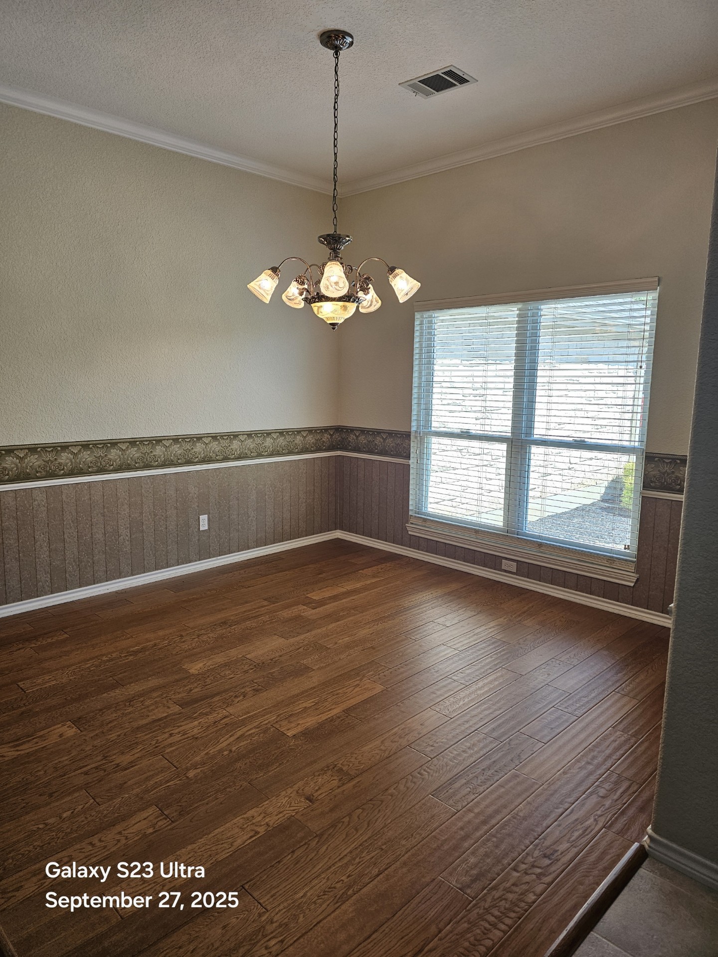 101 Texas Traditions Georgetown, TX 78628 - Photo 12 of 17 wooden floor in an empty room with a window