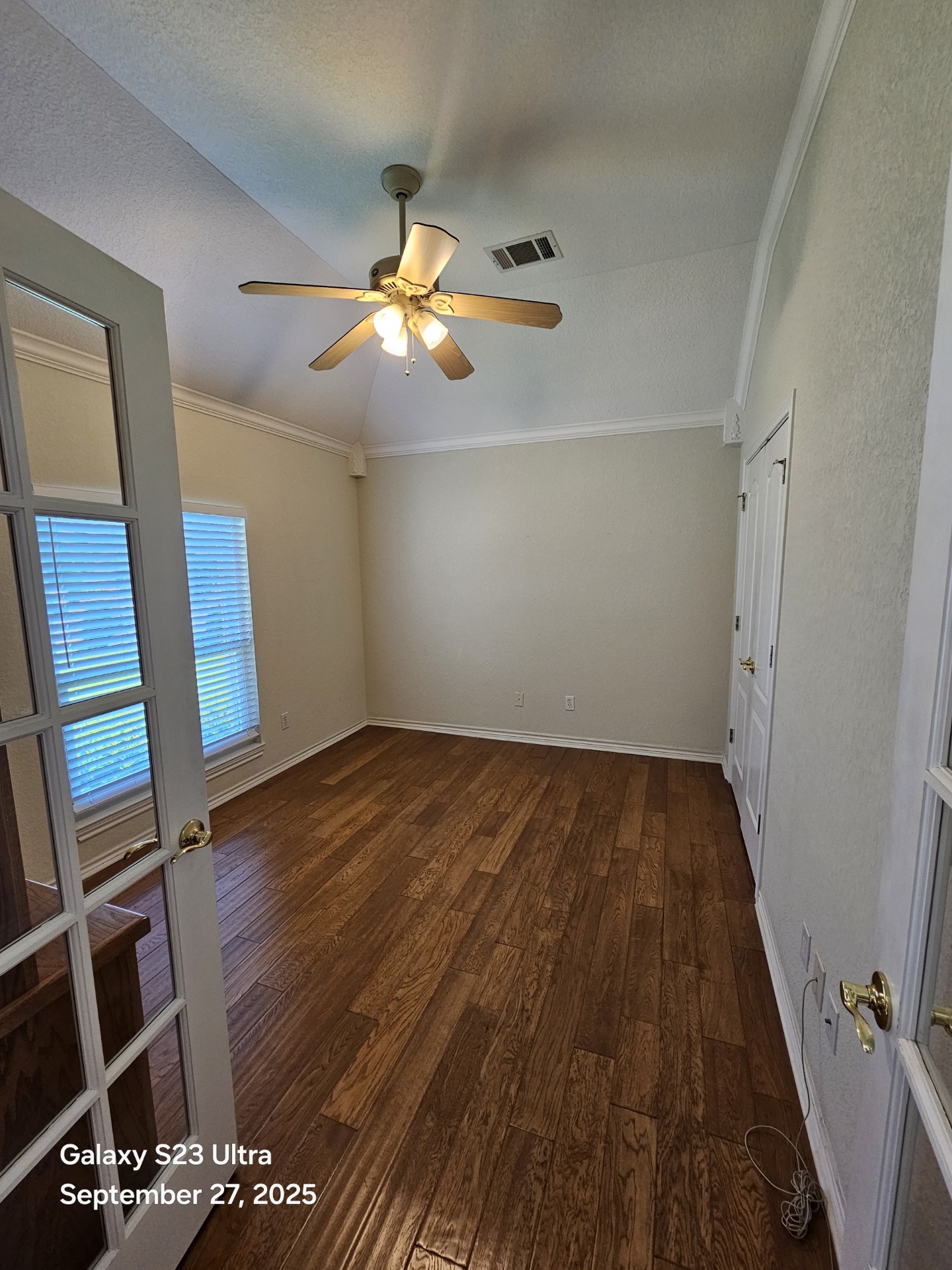 101 Texas Traditions Georgetown, TX 78628 - Photo 13 of 17 wooden floor in an empty room with a mirror