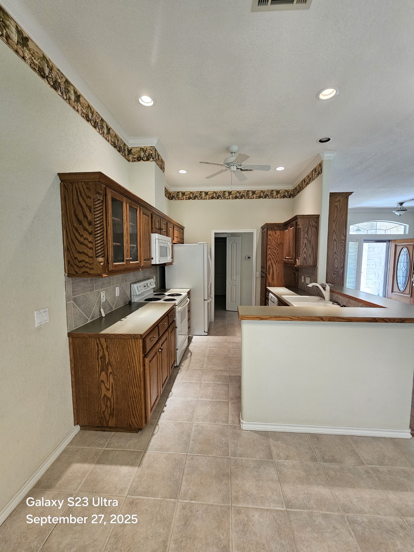 101 Texas Traditions Georgetown, TX 78628 - Photo 8 of 17 a large kitchen with stainless steel appliances granite countertop a large counter top and cabinets