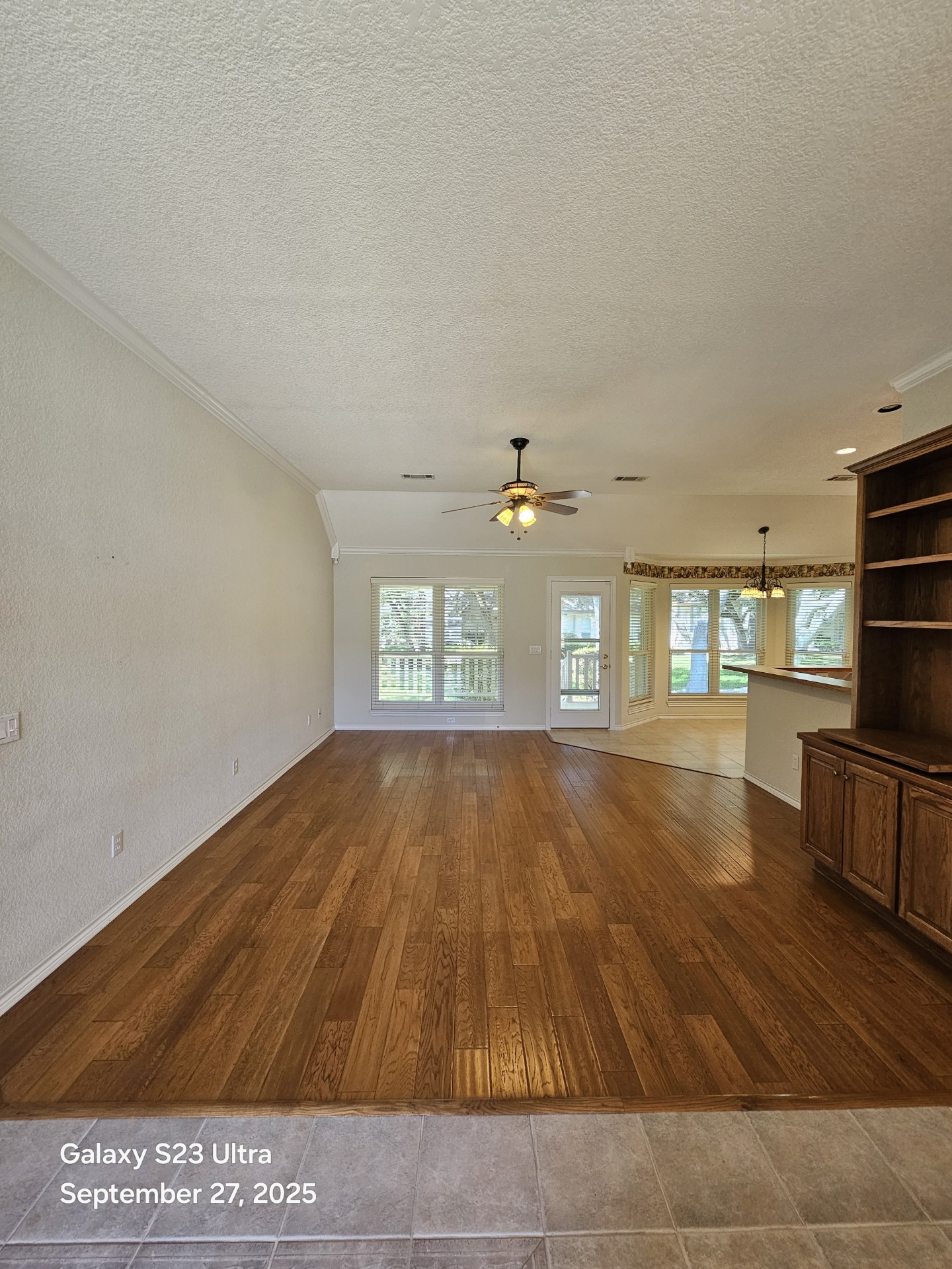 101 Texas Traditions Georgetown, TX 78628 - Photo 10 of 17 a view of empty room with wooden floor and fan