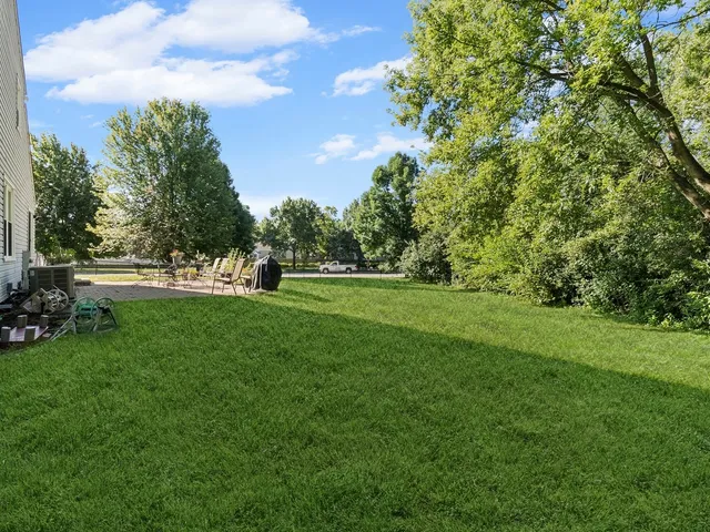 a view of field with trees in the background
