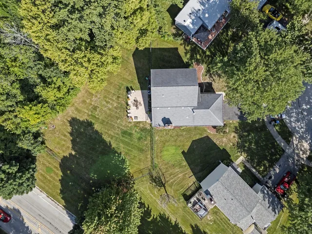 an aerial view of a house with outdoor space