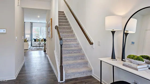 a kitchen with a table chairs sink and cabinets
