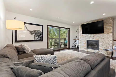 a bedroom with a large bed and a couch