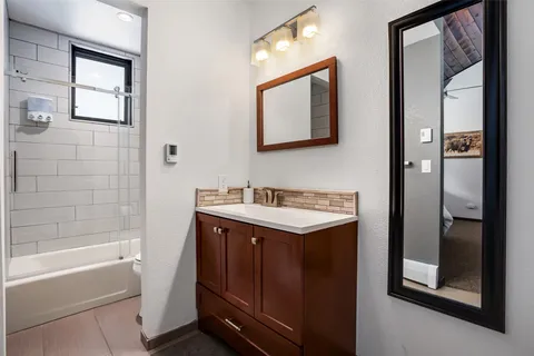 a bathroom with a sink and a bathtub