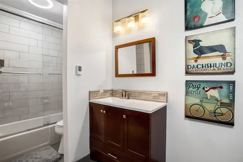 a bathroom with a sink a toilet and a bathtub