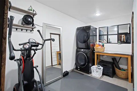 a utility room with multiple dryer and washer