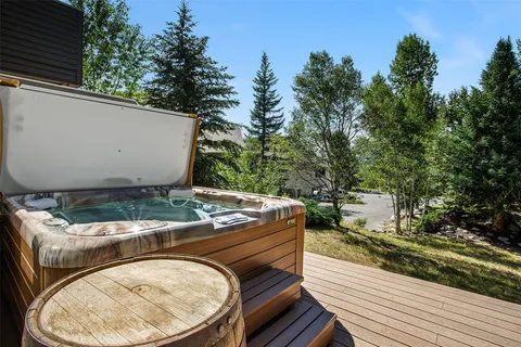 a view of a backyard with sitting area