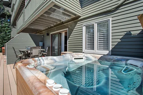 a balcony with table and chairs