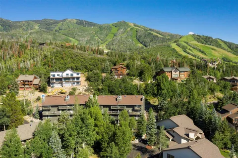 an aerial view of a house with a yard