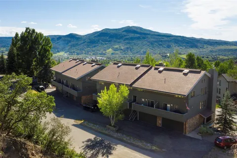 an aerial view of a house with a garden