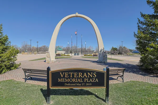 a swimming pool with buildings in the background
