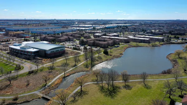 an aerial view of residential houses with outdoor space