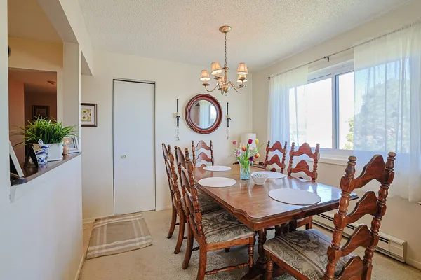 a dining room with furniture and window