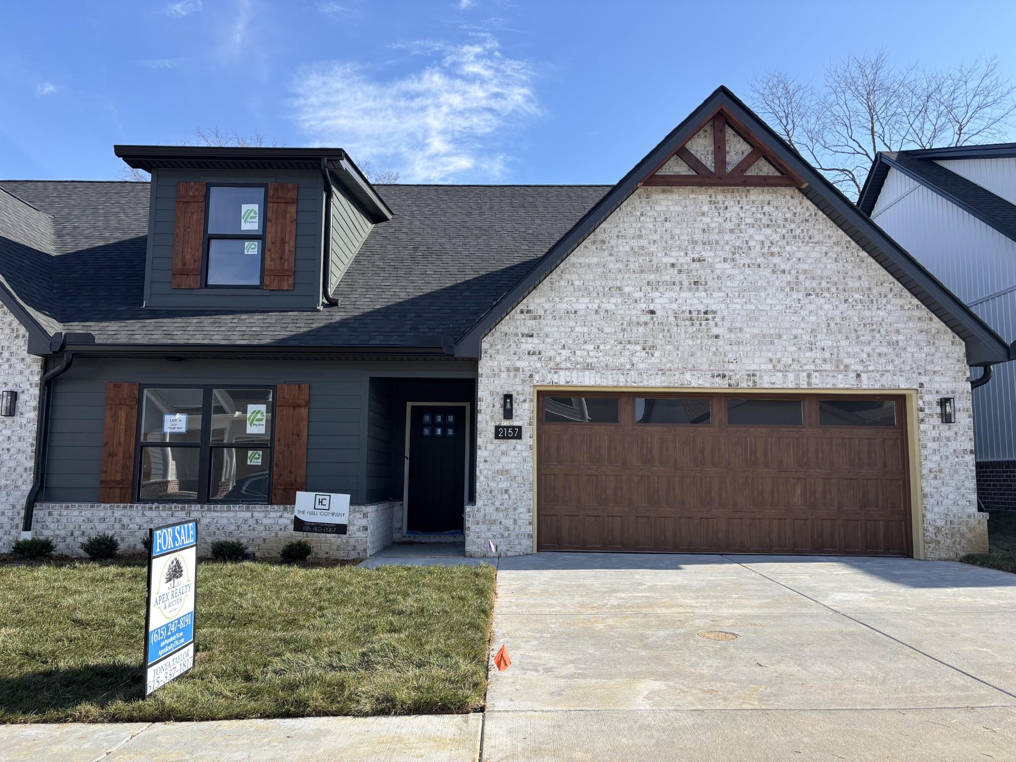 2157 Rylee Way Greenbrier, TN 37073 - Photo 1 of 5 a front view of a house with garden
