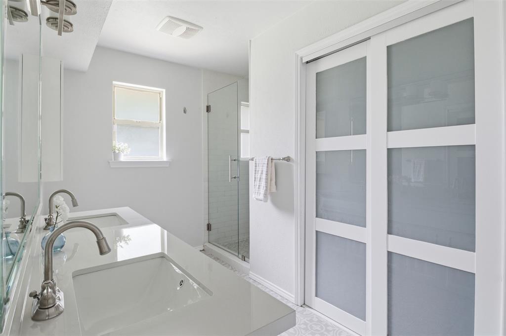 3712 Cemetery Hill Road Carrollton, TX 75007 - Photo 17 of 25 a bathroom with a sink and mirror