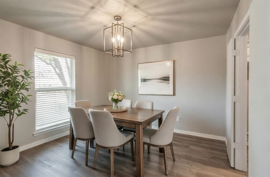 3712 Cemetery Hill Road Carrollton, TX 75007 - Photo 9 of 25 a view of a dining room with furniture wooden floor and chandelier