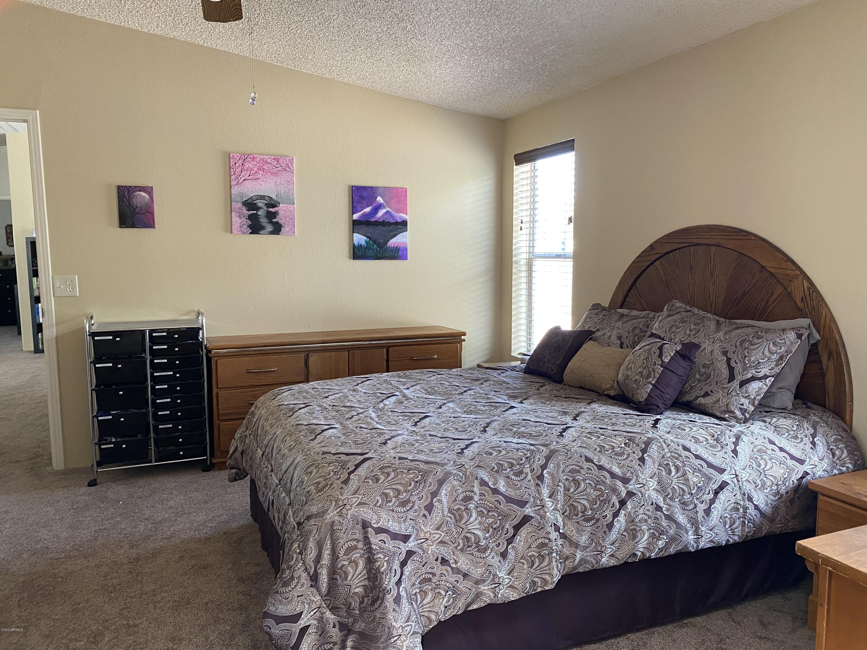 202 North Hawes Road Mesa, AZ 85207 - Photo 13 of 27 a bedroom with a bed and a closet