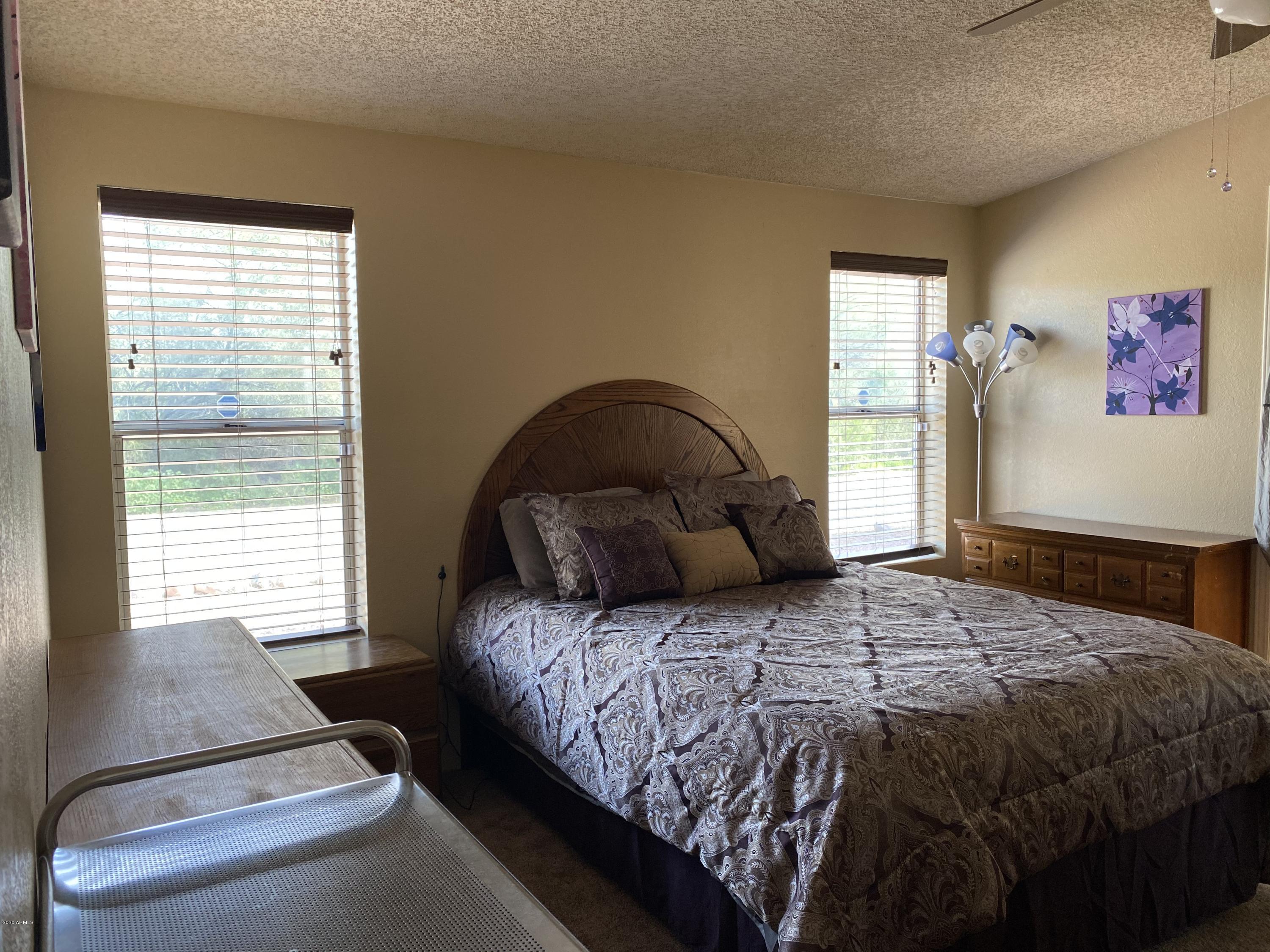 202 North Hawes Road Mesa, AZ 85207 - Photo 14 of 27 a bedroom with a bed and a window