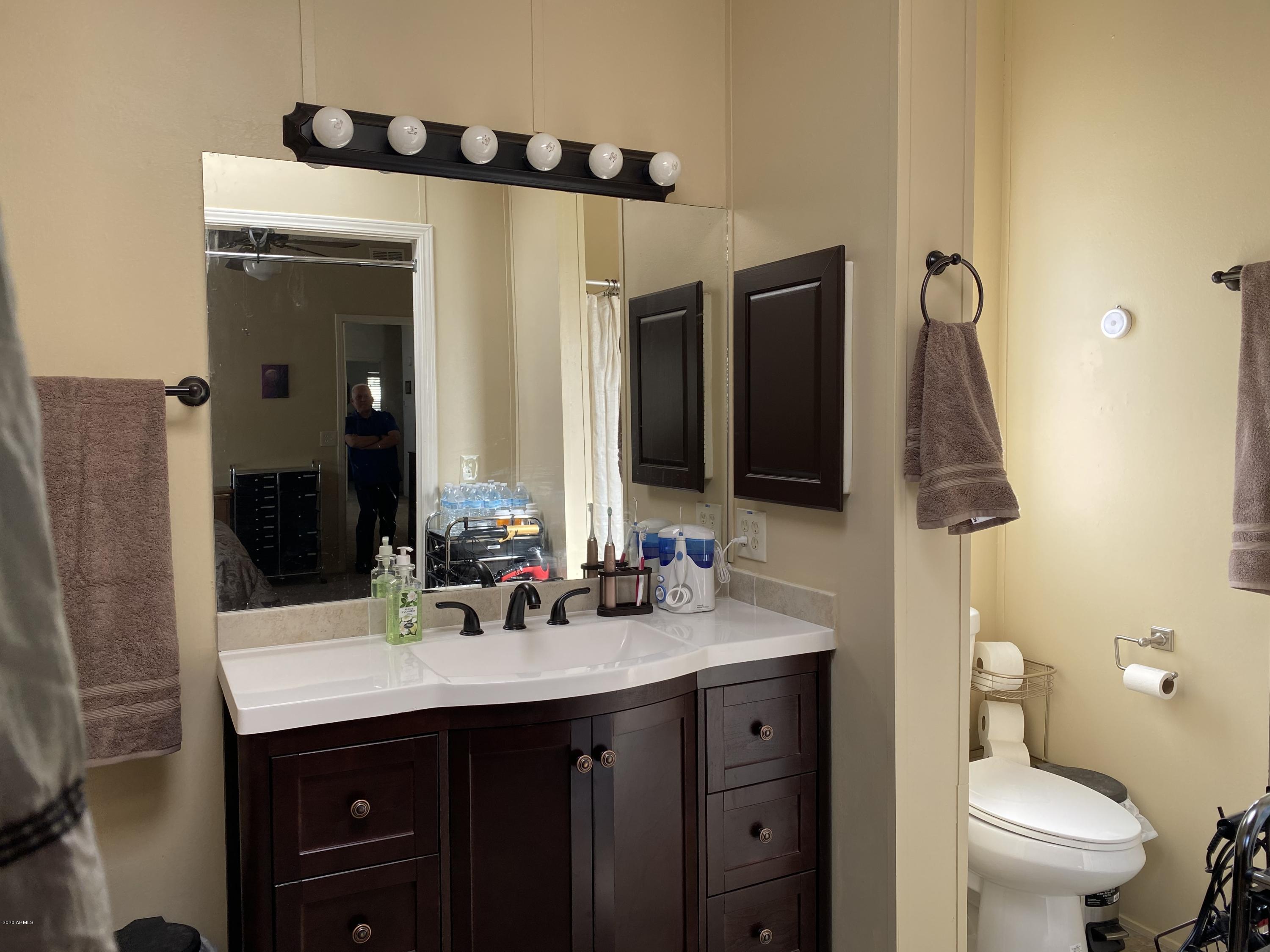 202 North Hawes Road Mesa, AZ 85207 - Photo 17 of 27 a bathroom with a sink and a mirror
