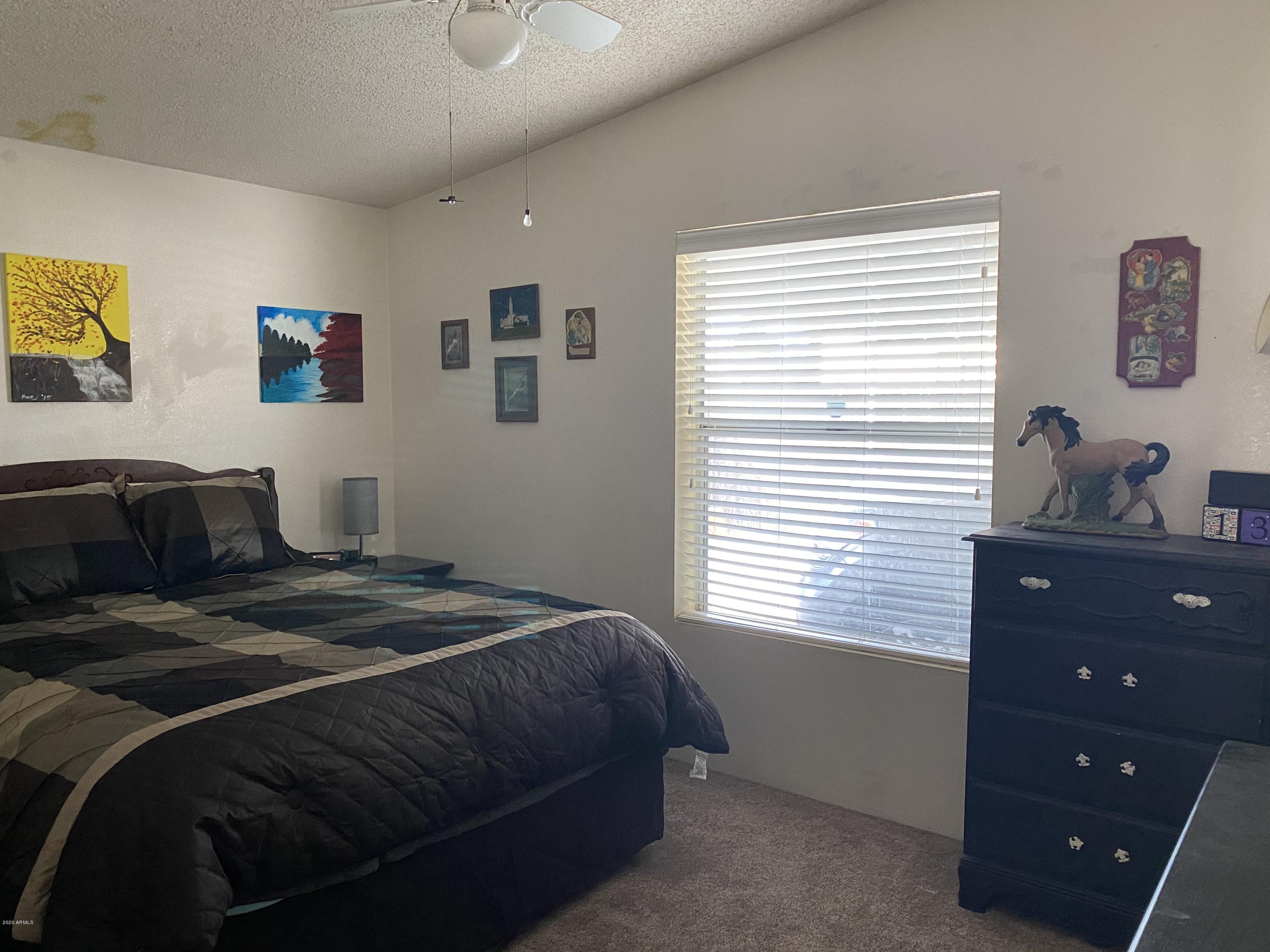 202 North Hawes Road Mesa, AZ 85207 - Photo 19 of 27 a bedroom with a bed and a window