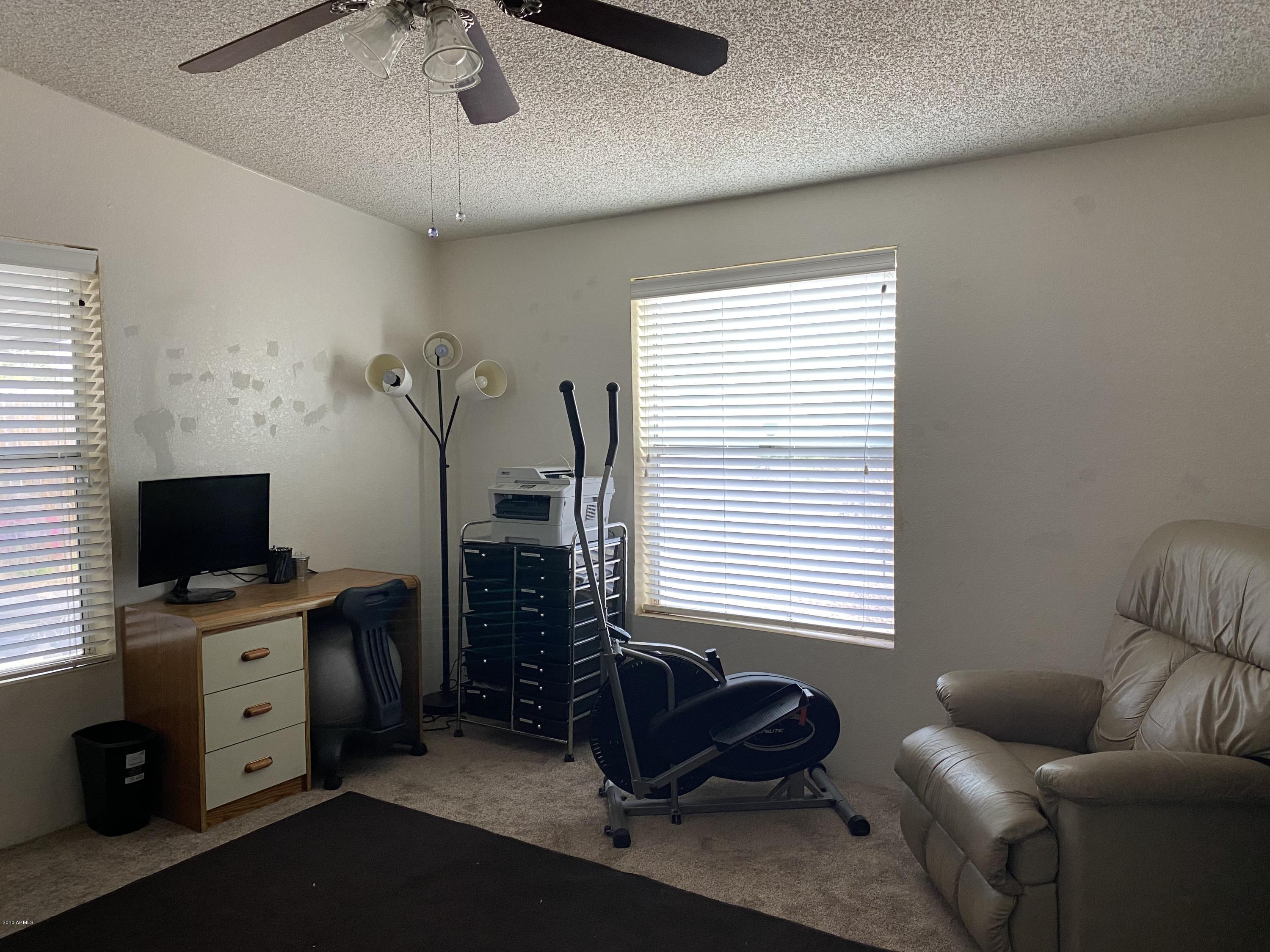 202 North Hawes Road Mesa, AZ 85207 - Photo 20 of 27 a livingroom with workspace and a window