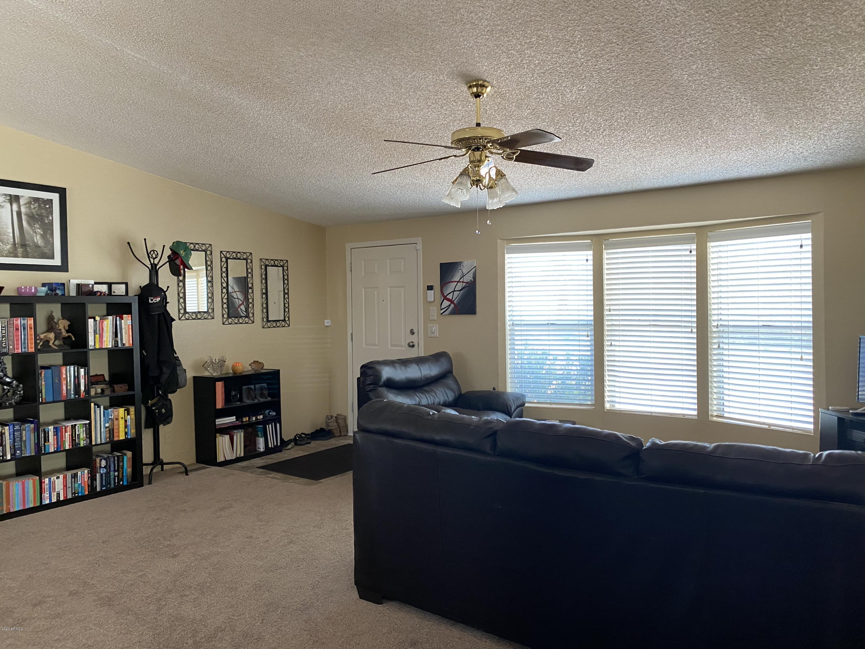 202 North Hawes Road Mesa, AZ 85207 - Photo 3 of 27 a living room with furniture and a window