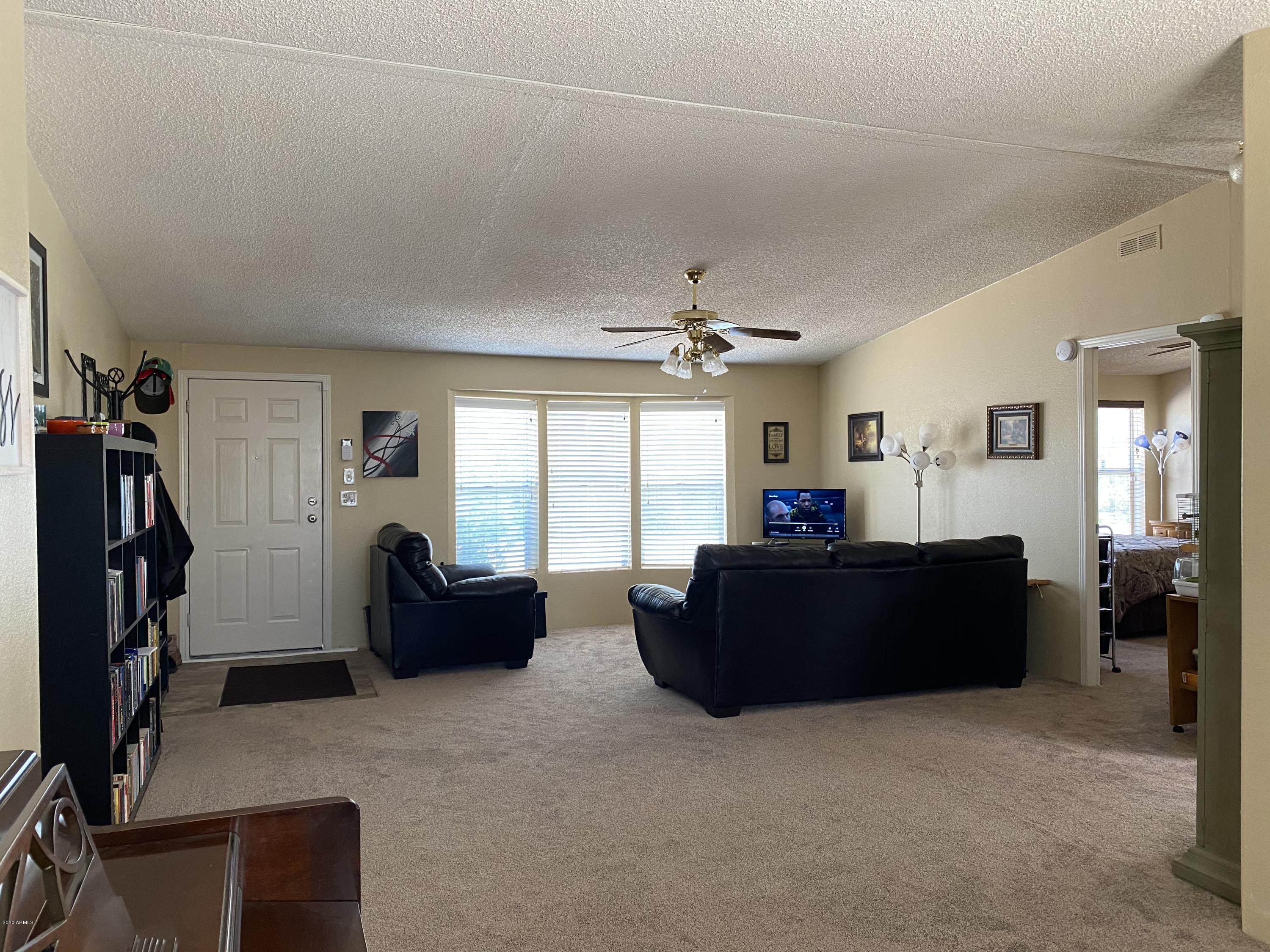 202 North Hawes Road Mesa, AZ 85207 - Photo 4 of 27 a living room with furniture and a window