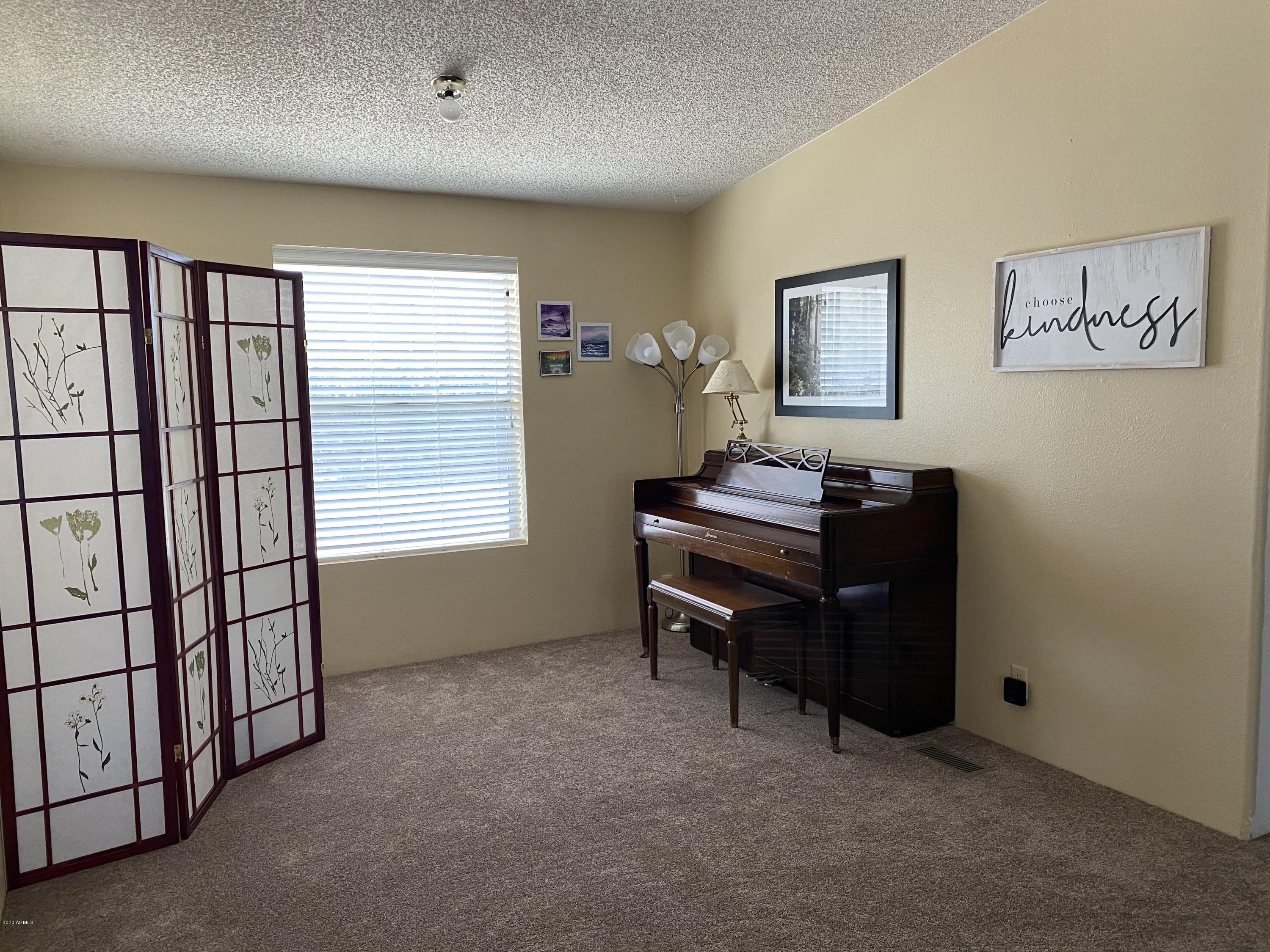 202 North Hawes Road Mesa, AZ 85207 - Photo 5 of 27 a view of a workspace with furniture and a window