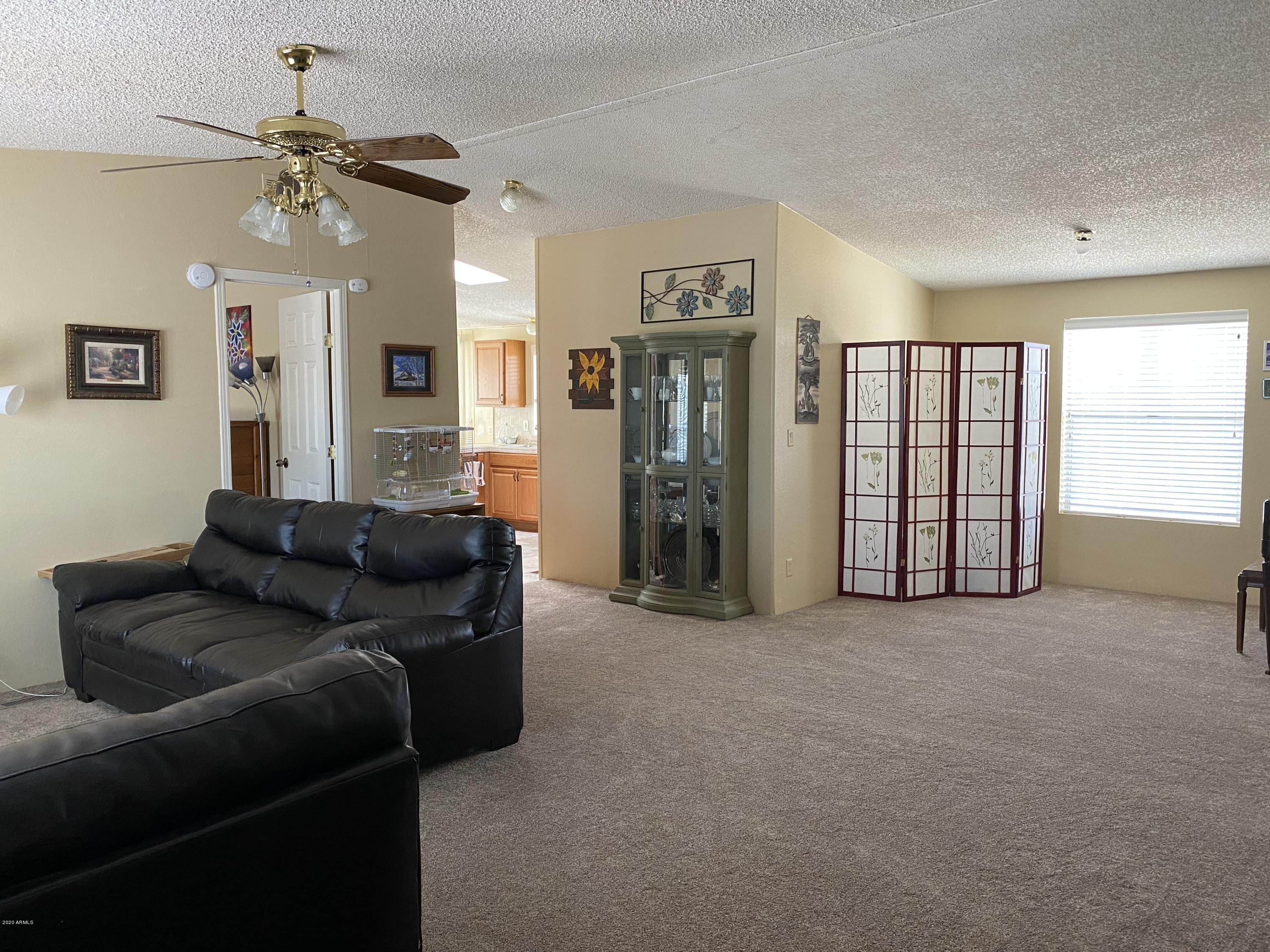 202 North Hawes Road Mesa, AZ 85207 - Photo 6 of 27 a living room with furniture and a window