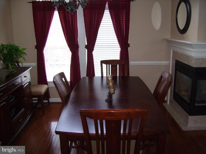 848 West Glebe Road Alexandria, VA 22305 - Photo 1 of 18 a view of a dining room with furniture window and wooden floor