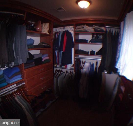 848 West Glebe Road Alexandria, VA 22305 - Photo 16 of 18 a view of walk in closet with clothes and shoes