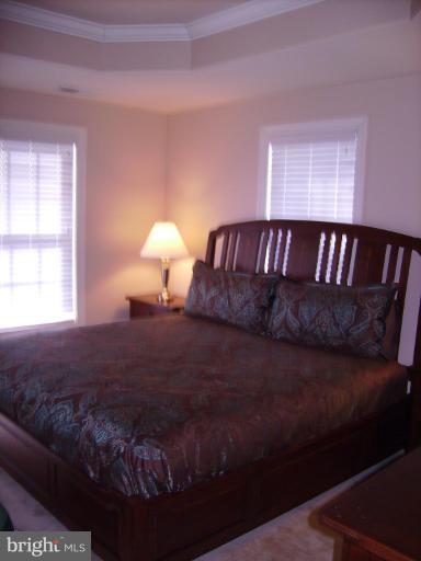 848 West Glebe Road Alexandria, VA 22305 - Photo 18 of 18 a bed sitting in a bedroom next to a window