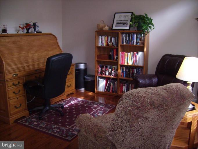 848 West Glebe Road Alexandria, VA 22305 - Photo 3 of 18 a view of a workspace with a bookshelf