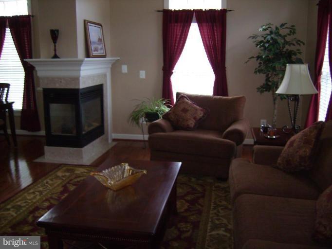 848 West Glebe Road Alexandria, VA 22305 - Photo 6 of 18 a living room with furniture and a fireplace