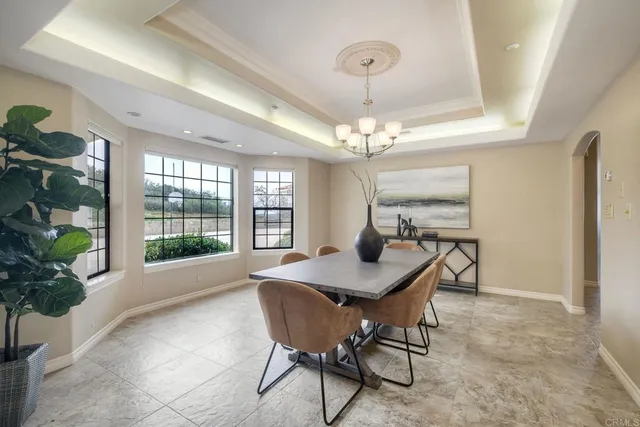 a room with gym equipment pool table and windows