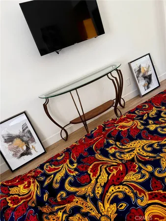a picture of a room with toys and wooden floor