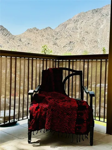 a bed sitting in a room next to a window