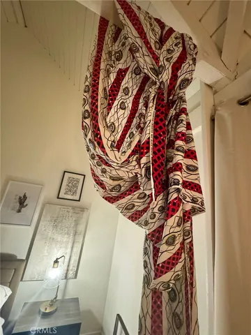 walk in closet with clothes and shoes