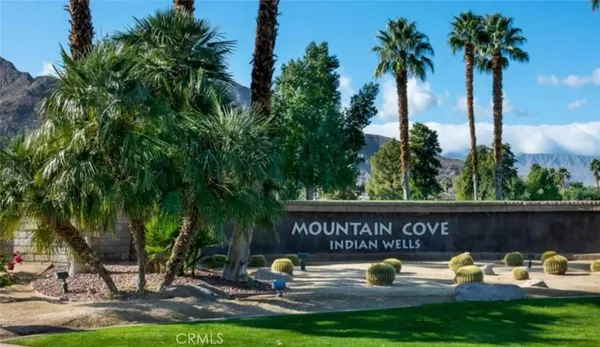 a view of a swimming pool with a patio and a garden