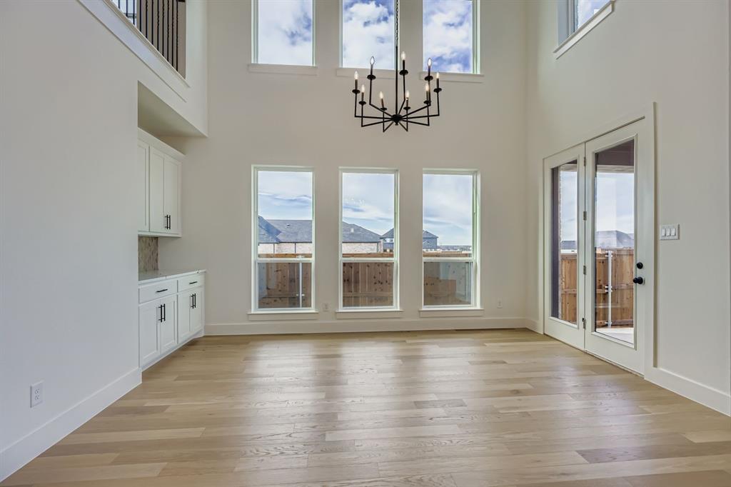 2608 Cedar Rdg Road Celina, TX 75009 - Photo 11 of 29 a view of an empty room with a window and wooden floor