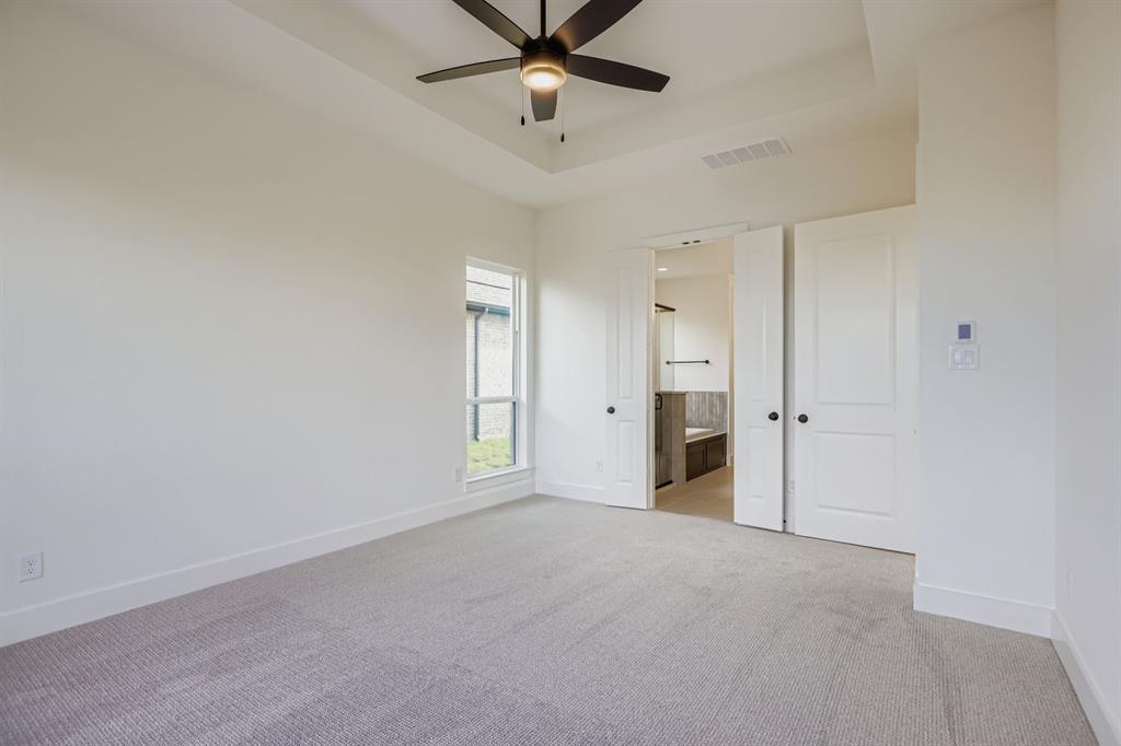 2608 Cedar Rdg Road Celina, TX 75009 - Photo 14 of 29 a view of an empty room with a ceiling fan
