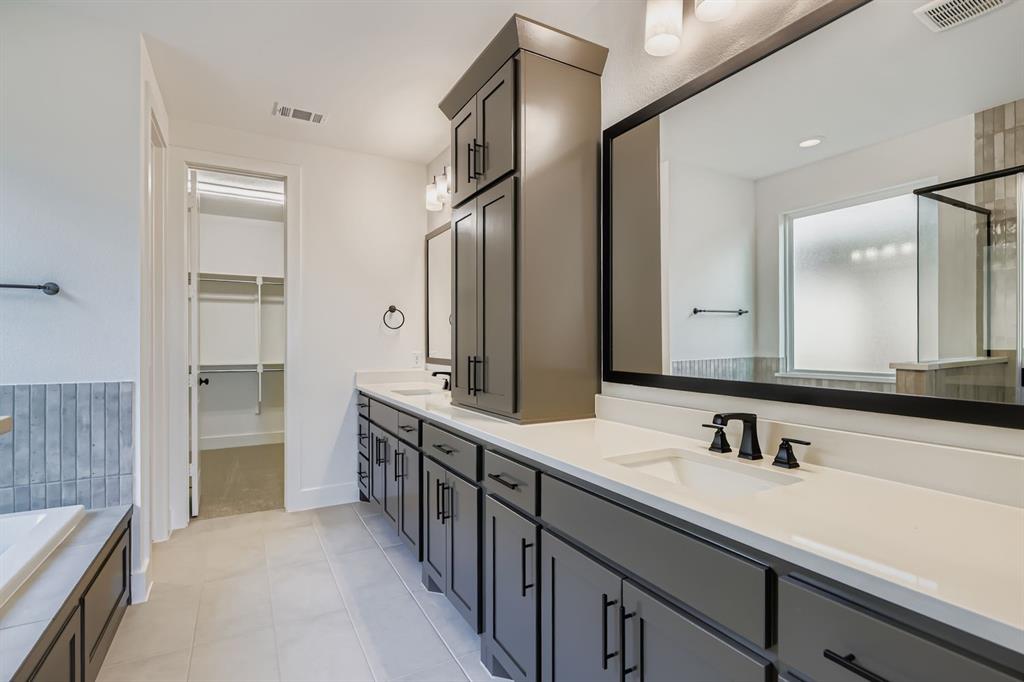 2608 Cedar Rdg Road Celina, TX 75009 - Photo 15 of 29 a bathroom with a double vanity sink a and a mirror