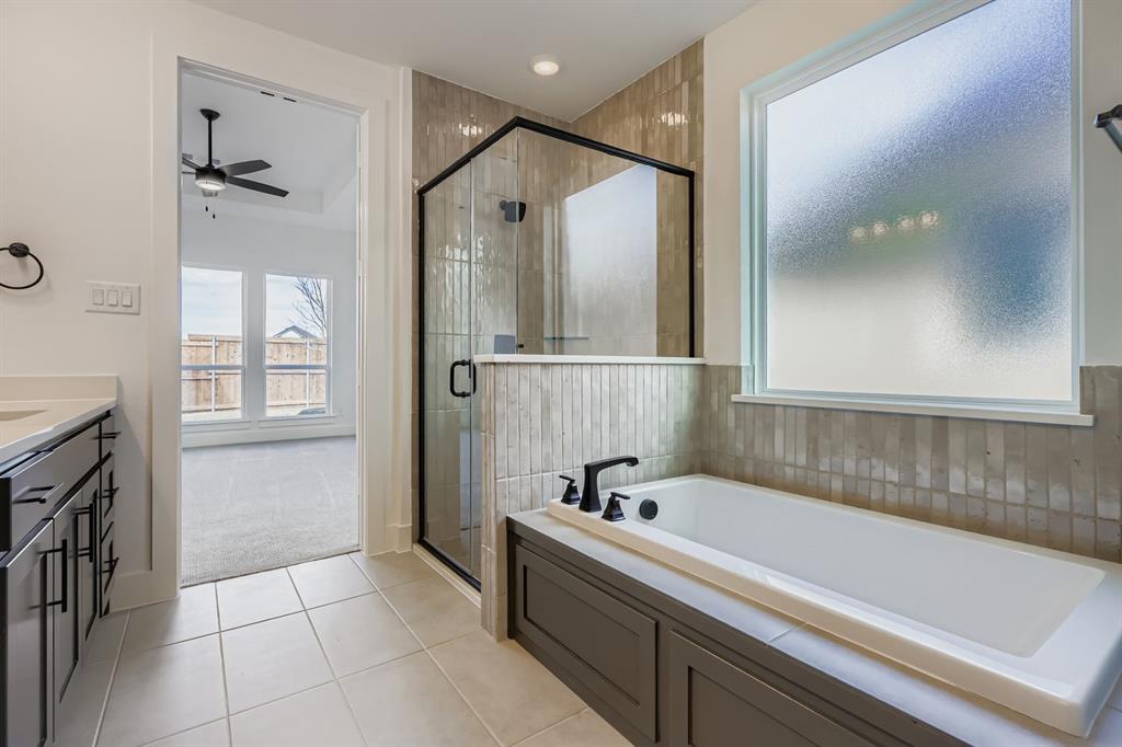 2608 Cedar Rdg Road Celina, TX 75009 - Photo 16 of 29 a bathroom with a bathtub and a shower