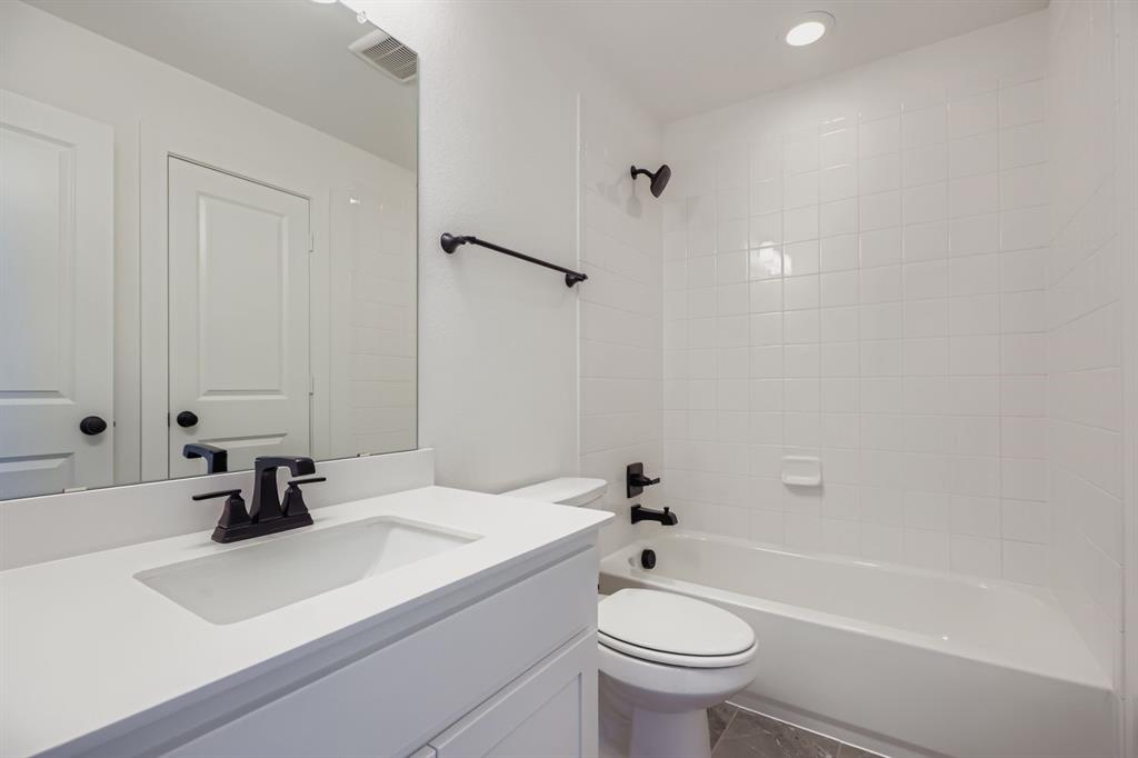 2608 Cedar Rdg Road Celina, TX 75009 - Photo 21 of 29 a bathroom with a sink a toilet and a bathtub