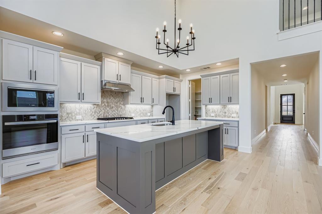 2608 Cedar Rdg Road Celina, TX 75009 - Photo 8 of 29 a kitchen with a sink stainless steel appliances and cabinets