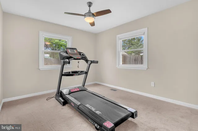 a room with gym equipment and a window