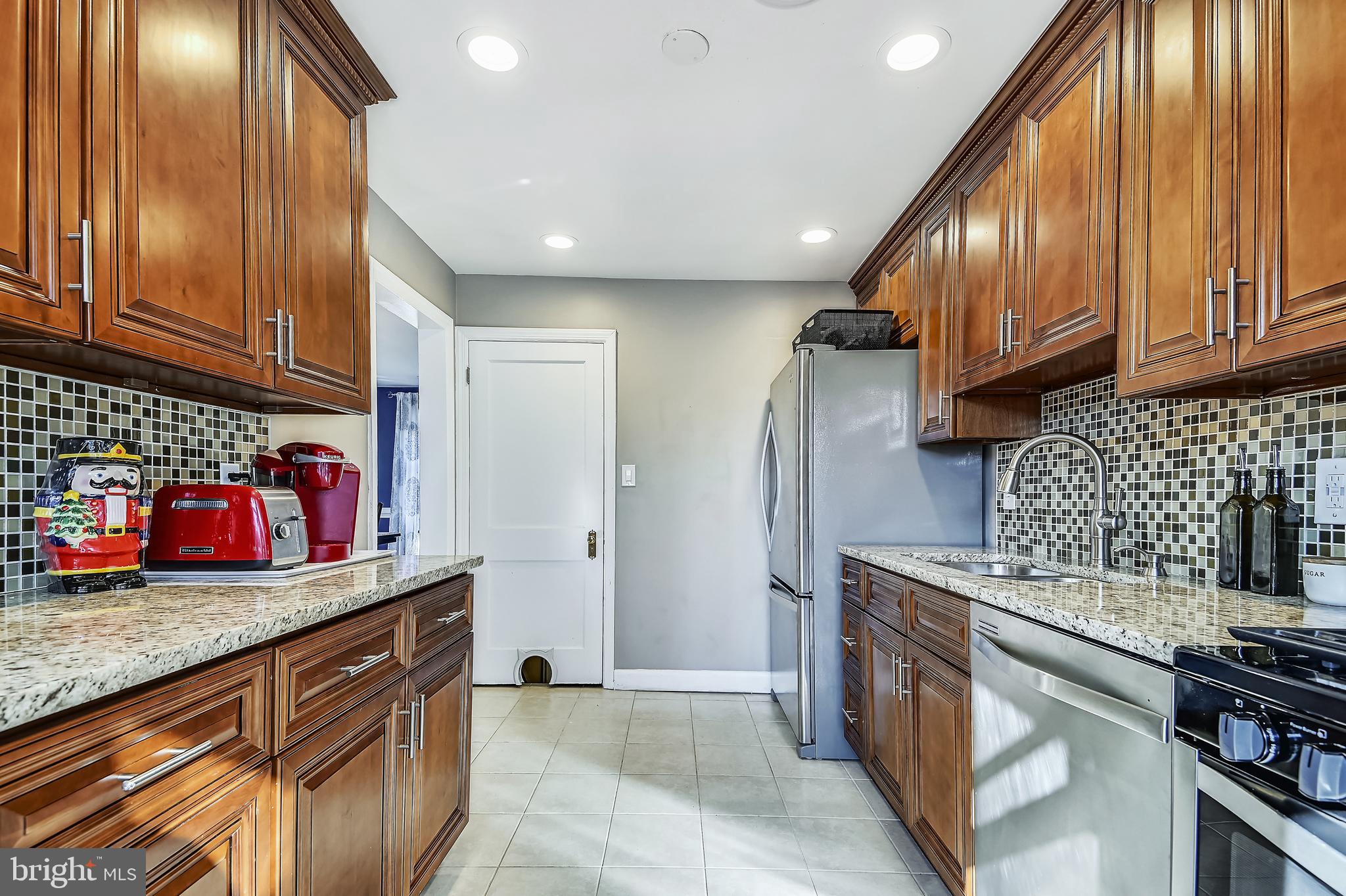 4111 Colonial Road Baltimore, MD 21208 - Photo 6 of 33 ample counter space and custom tile backsplash