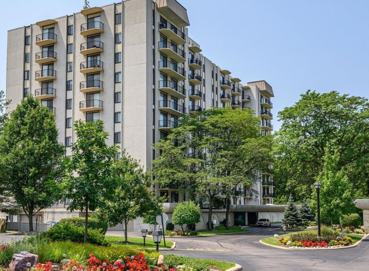 a view of tall buildings and a street