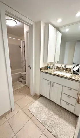 a bathroom with a toilet and a bathtub